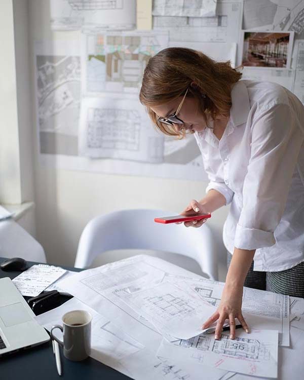 modern-architect-taking-pictures-of-drafts-BMRKFFT modern-architect-taking-pictures-of-drafts-BMRKFFT